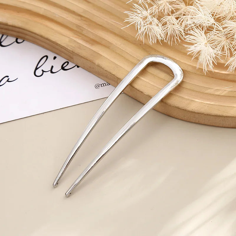 Colette Minimal slim metal hair pin in a bun