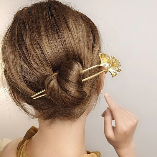 Colette Ginkgo leaf and pearl hair pin in a chignon