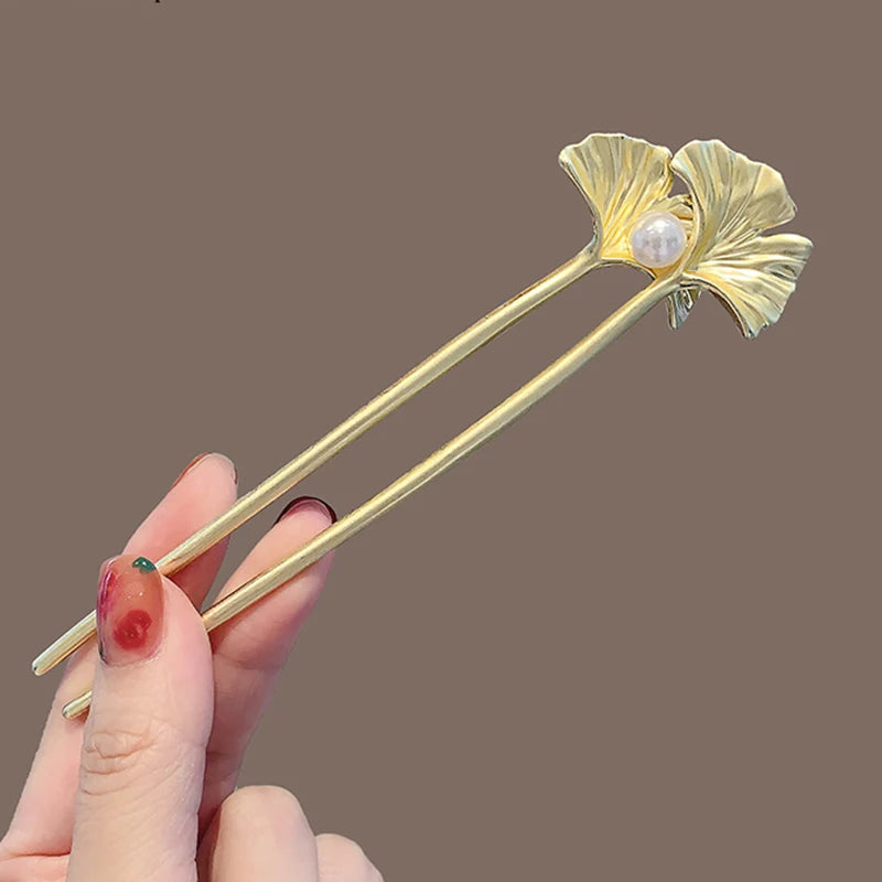 Colette Ginkgo leaf and pearl hair pin in a chignon