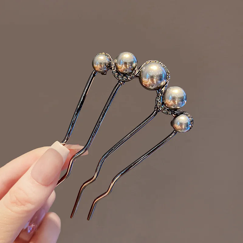 Colette Atelier pearl hair stick in a bun