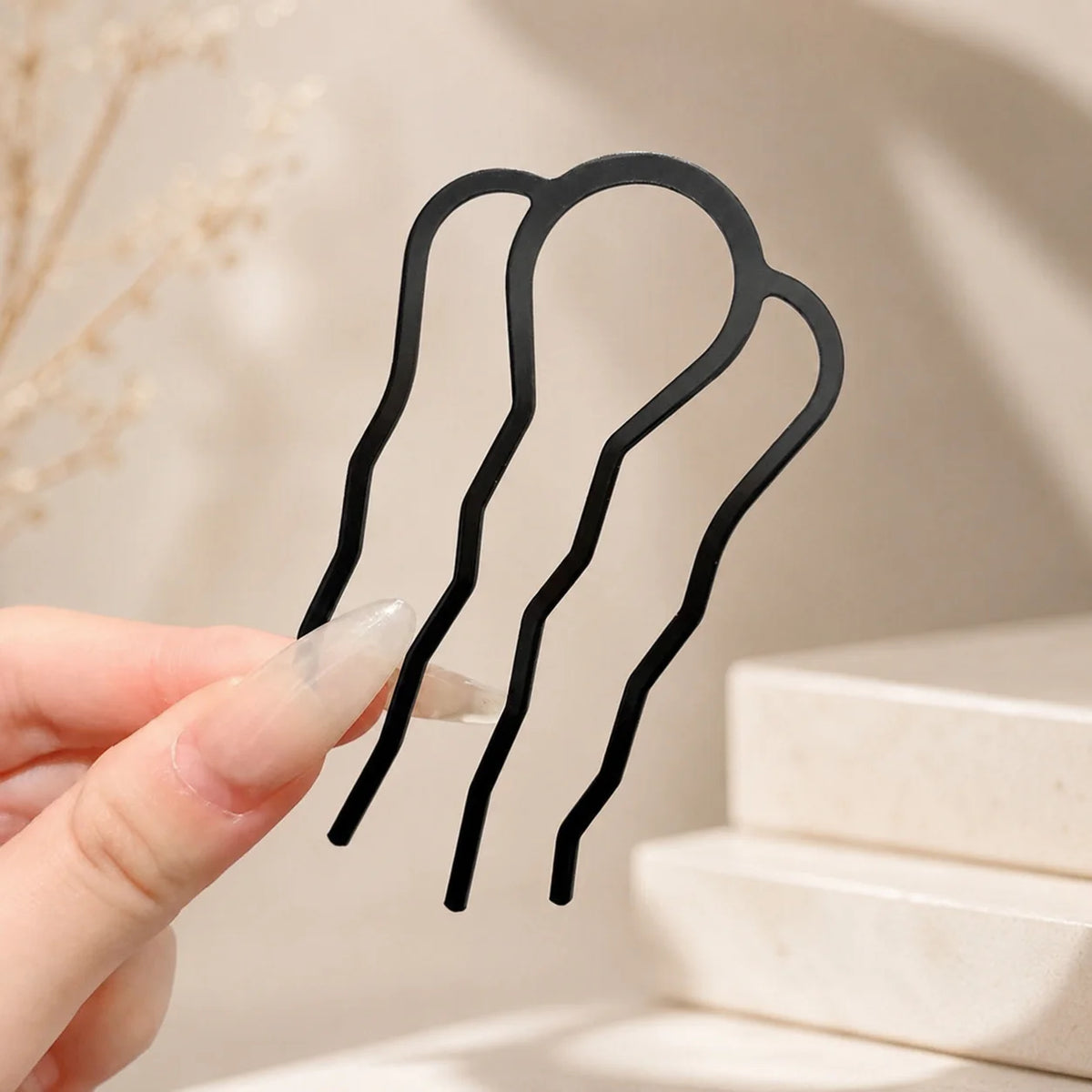 Colette Perle pearl-topped French hair pin in a chignon