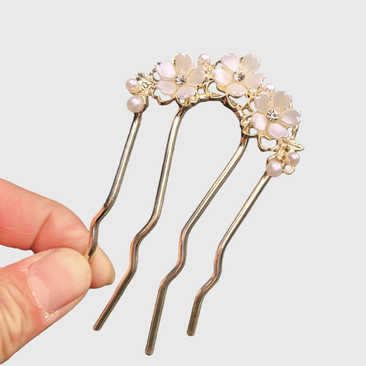 Colette Jardin blue crystal flower hair pin in an updo