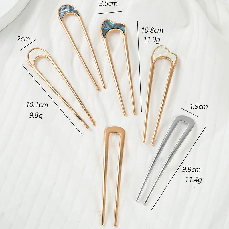 Colette Nacre shell-inlay gold French hair pin in a chignon