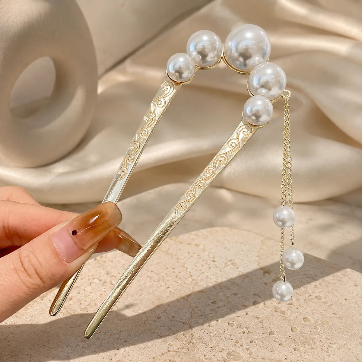 Colette Perle pearl-topped French hair pin in a chignon