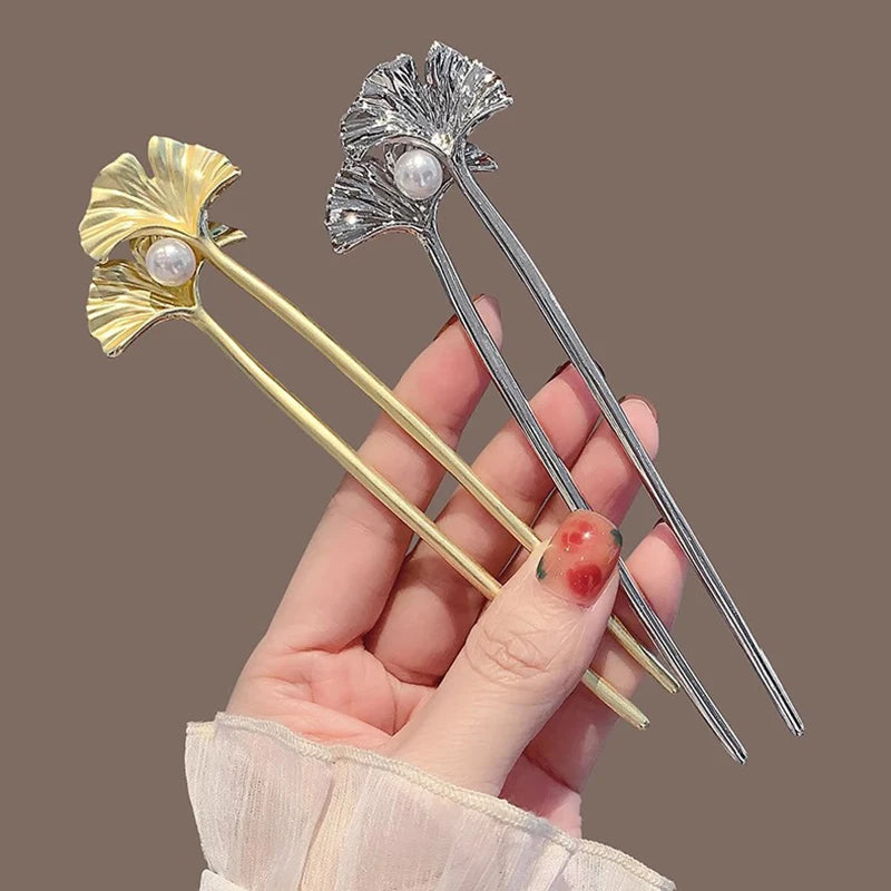 Colette Ginkgo leaf and pearl hair pin in a chignon