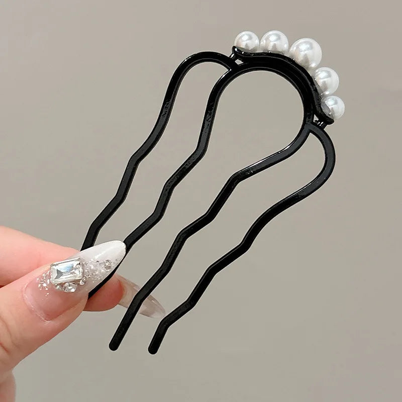 Colette Atelier pearl hair stick in a bun