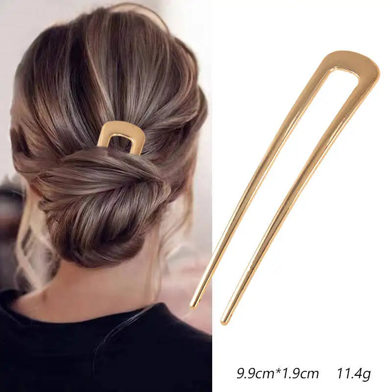 Colette Nacre shell-inlay gold French hair pin in a chignon