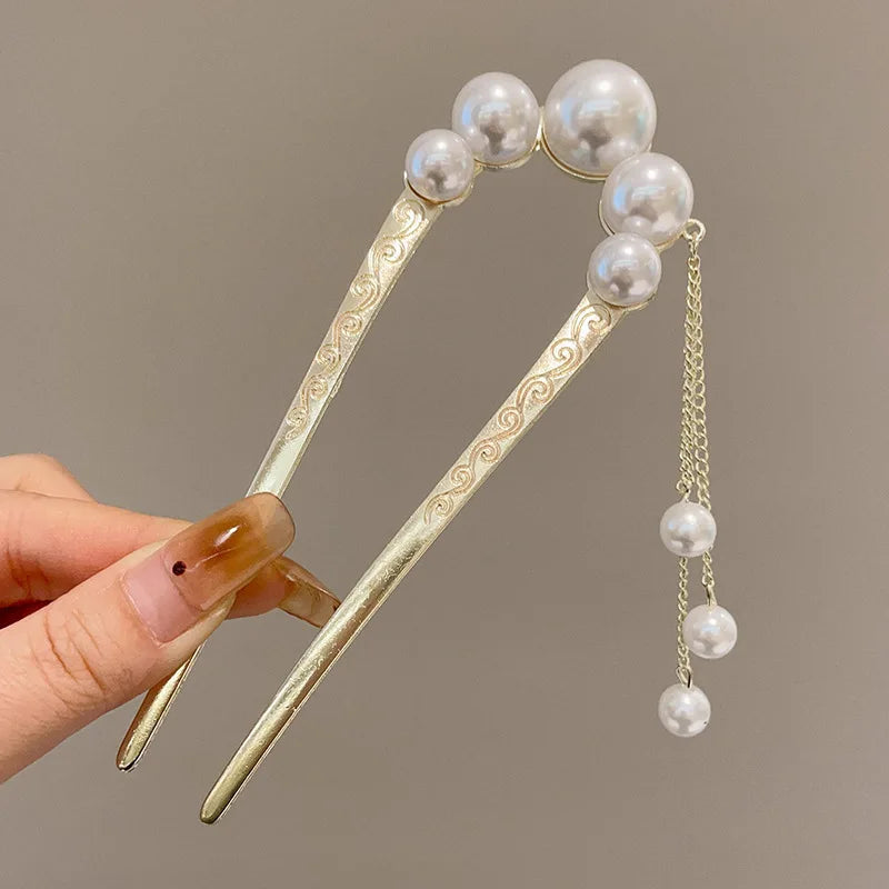 Colette Atelier pearl hair stick in a bun