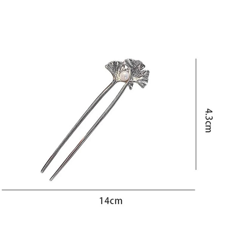 Colette Ginkgo leaf and pearl hair pin in a chignon