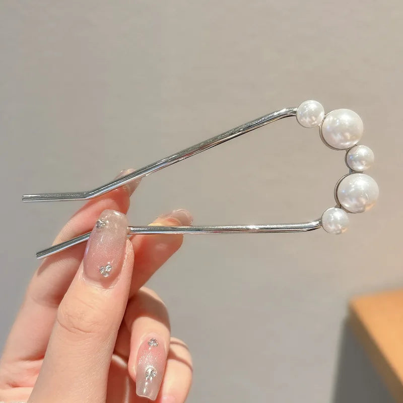 Colette Atelier pearl hair stick in a bun