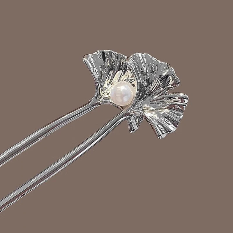 Colette Ginkgo leaf and pearl hair pin in a chignon