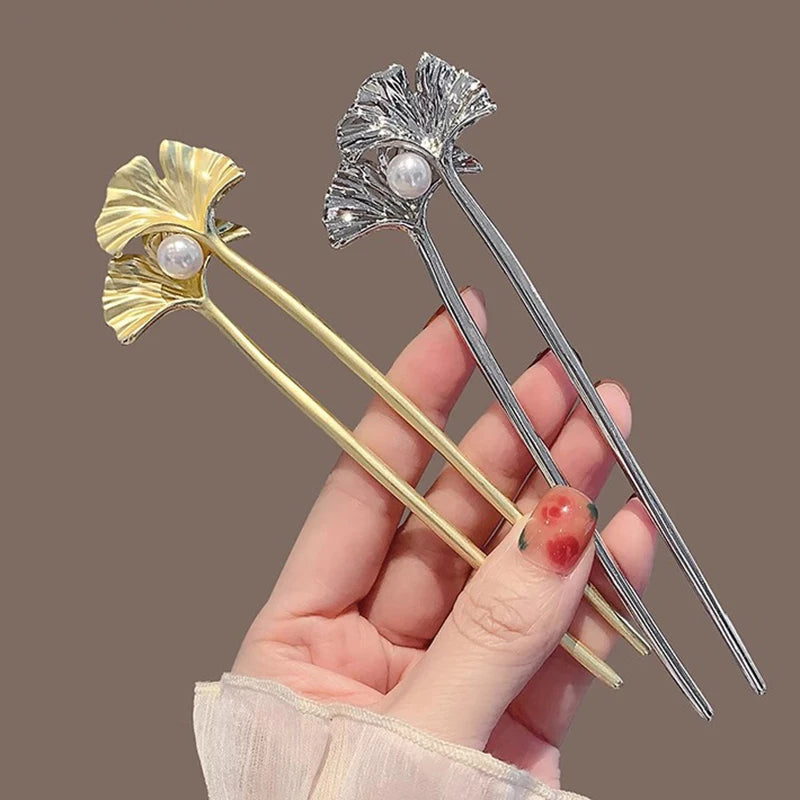Colette Ginkgo leaf and pearl hair pin in a chignon