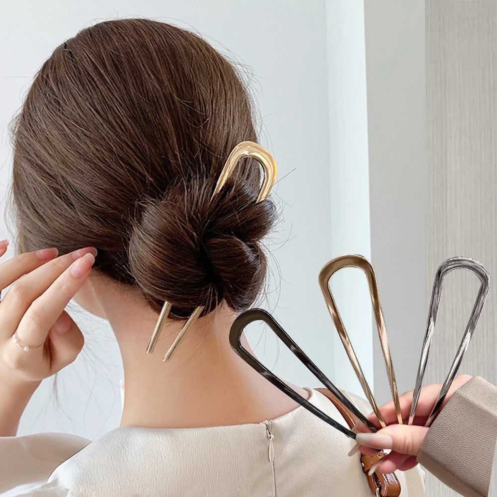 Colette Minimal slim metal hair pin in a bun