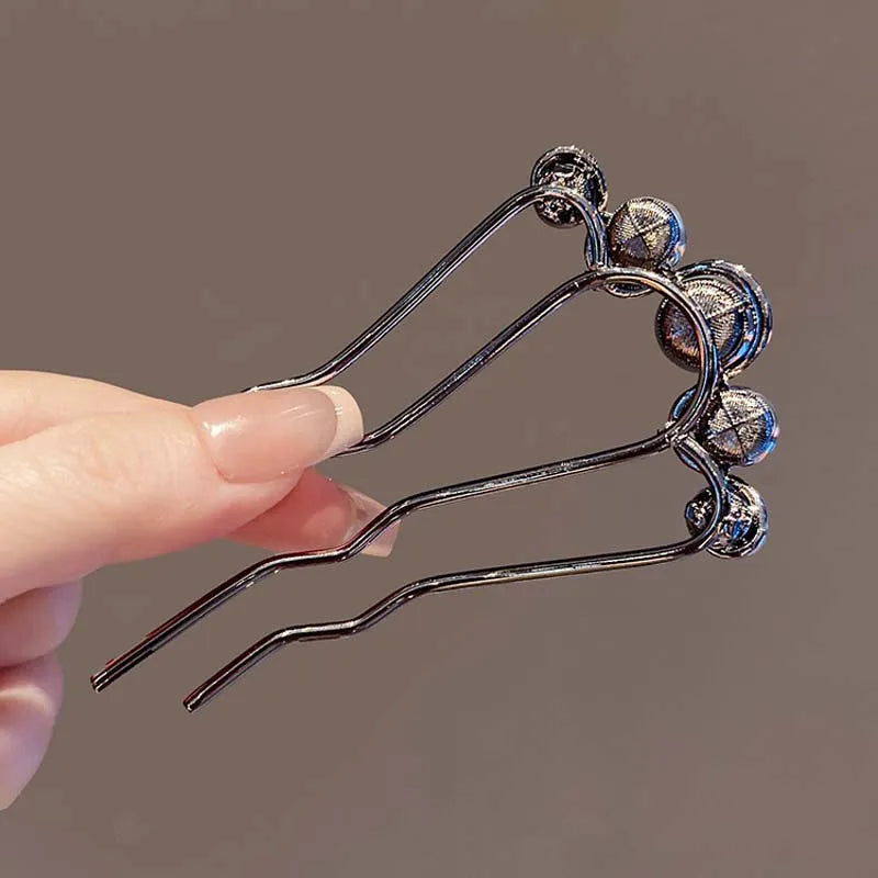 Colette Grace pearl-crowned hair pin in a bun