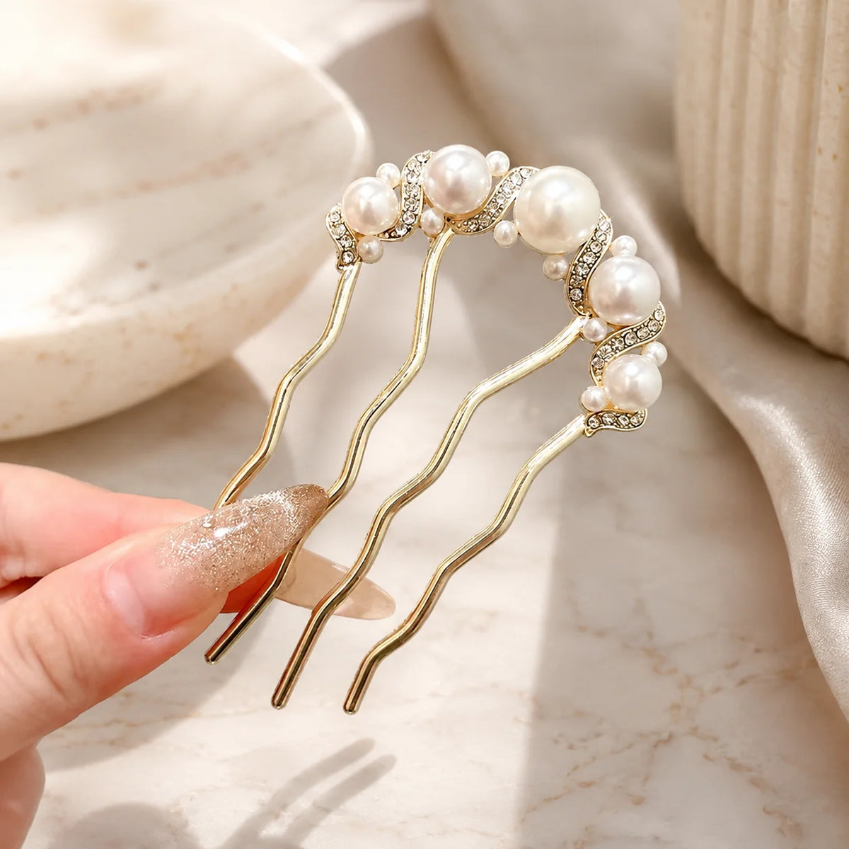 Colette Perle pearl-topped French hair pin in a chignon