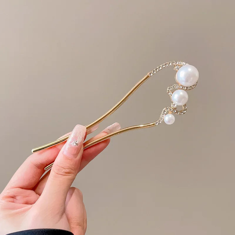 Colette Atelier pearl hair stick in a bun