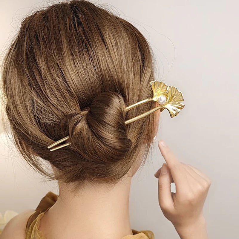 Colette Ginkgo leaf and pearl hair pin in a chignon