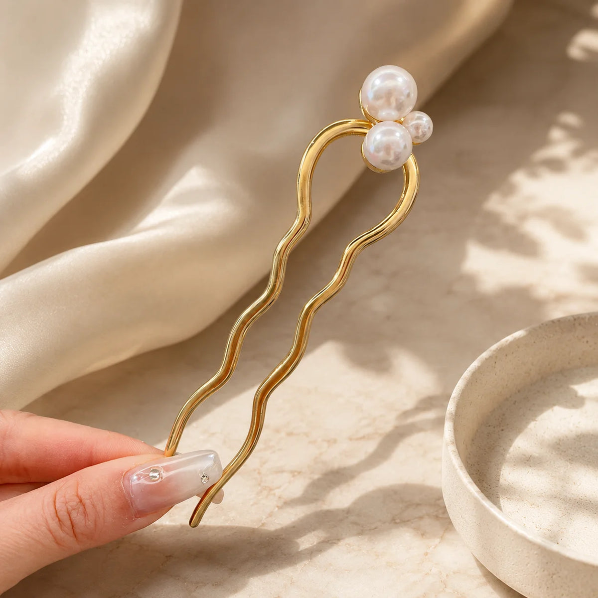 Colette Perle pearl-topped French hair pin in a chignon