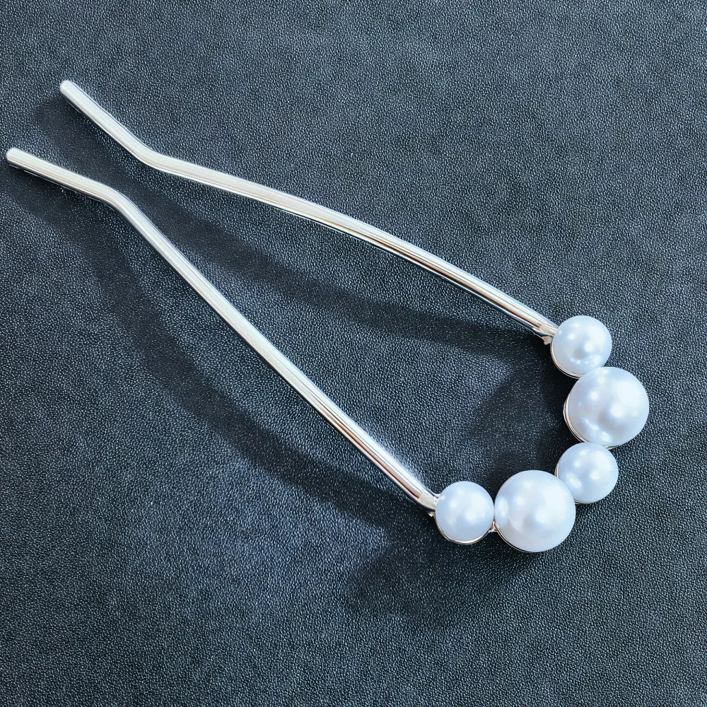 Colette Jardin blue crystal flower hair pin in an updo