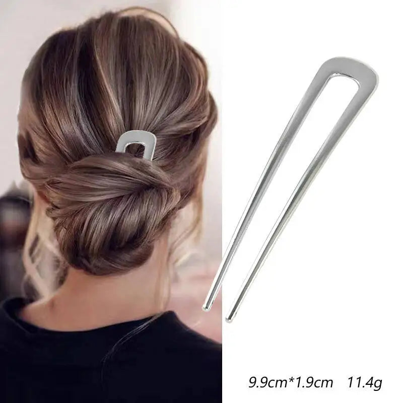Colette Nacre shell-inlay gold French hair pin in a chignon
