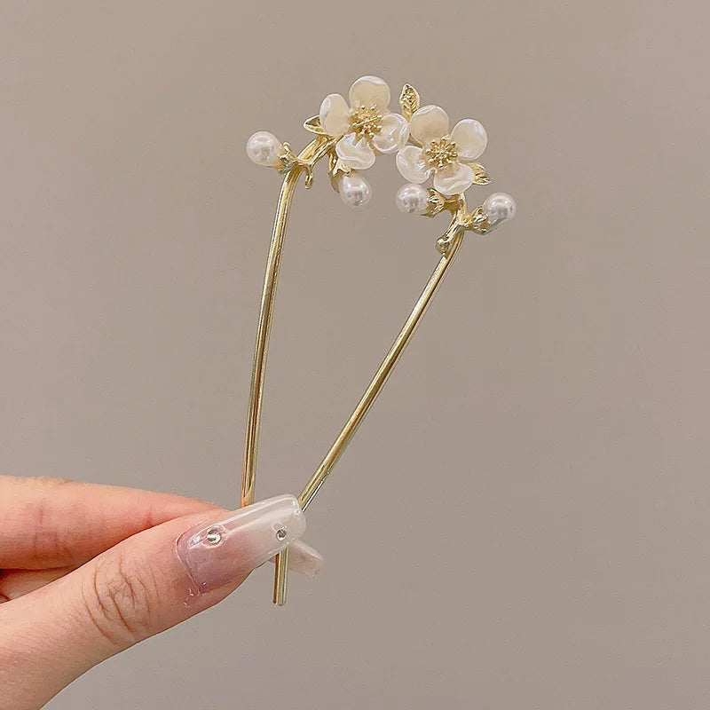 Colette Atelier pearl hair stick in a bun