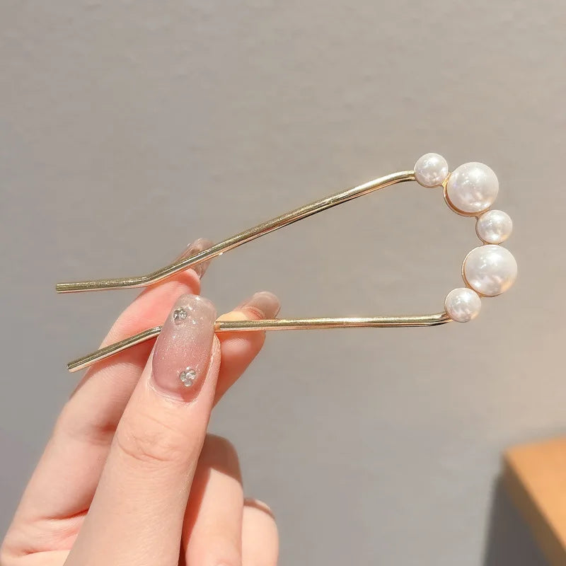 Colette Atelier pearl hair stick in a bun