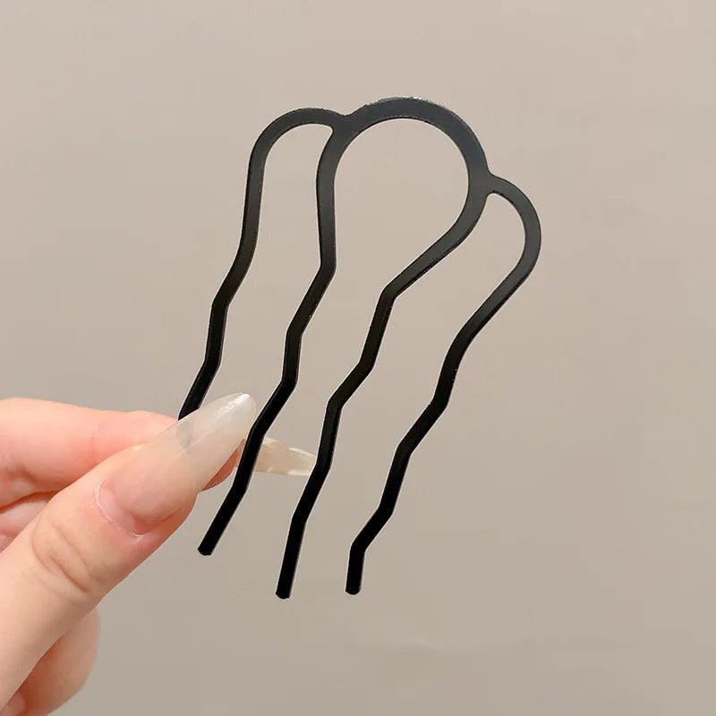 Colette Atelier pearl hair stick in a bun