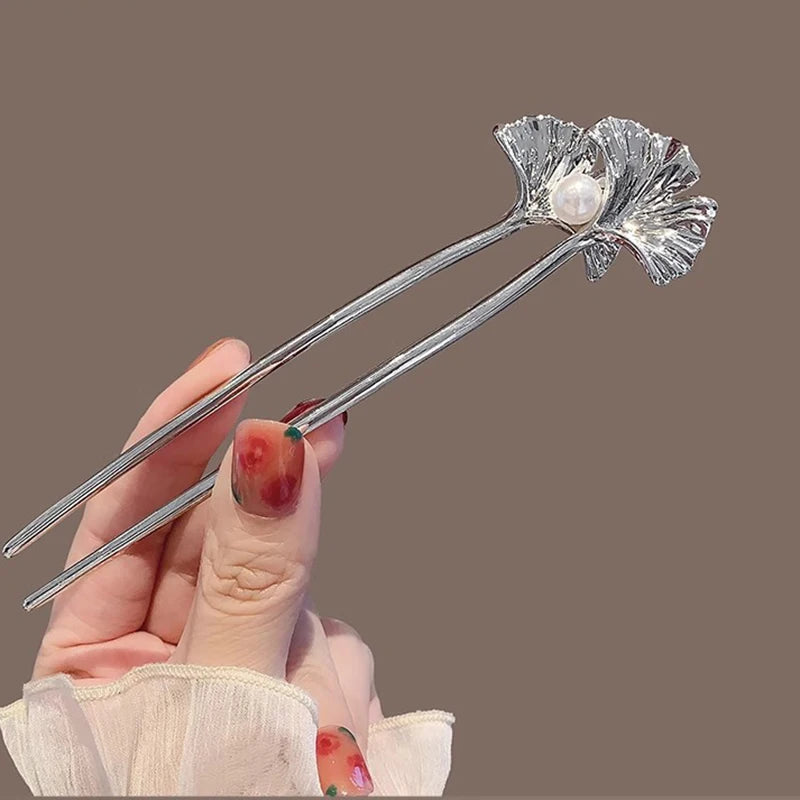 Colette Ginkgo leaf and pearl hair pin in a chignon
