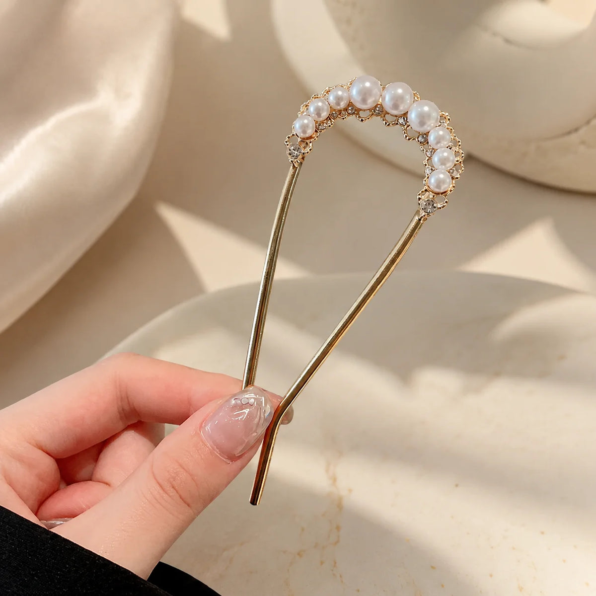Colette Perle pearl-topped French hair pin in a chignon