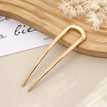Colette Minimal slim metal hair pin in a bun
