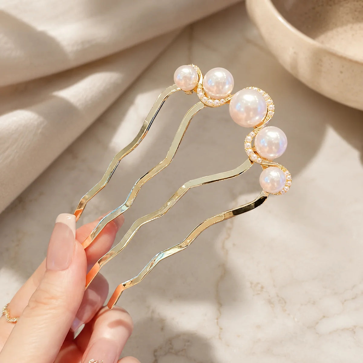 Colette Perle pearl-topped French hair pin in a chignon