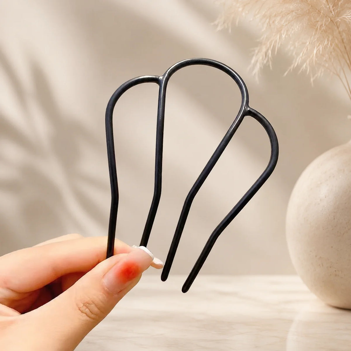 Colette Perle pearl-topped French hair pin in a chignon