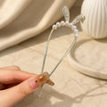 Colette Perle pearl-topped French hair pin in a chignon