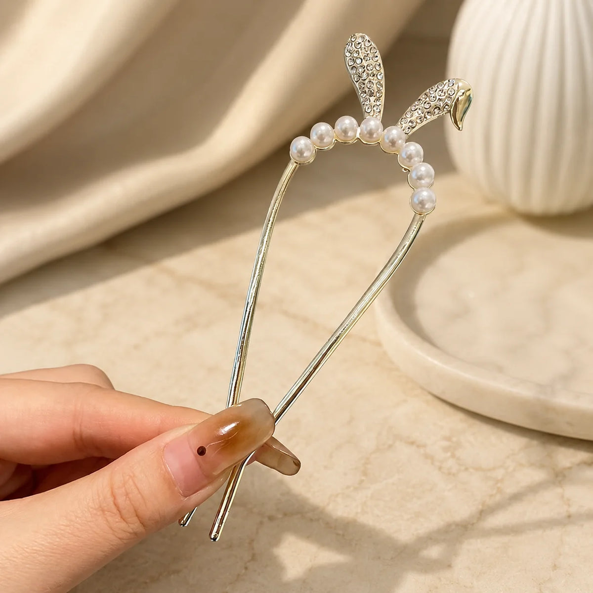 Colette Perle pearl-topped French hair pin in a chignon