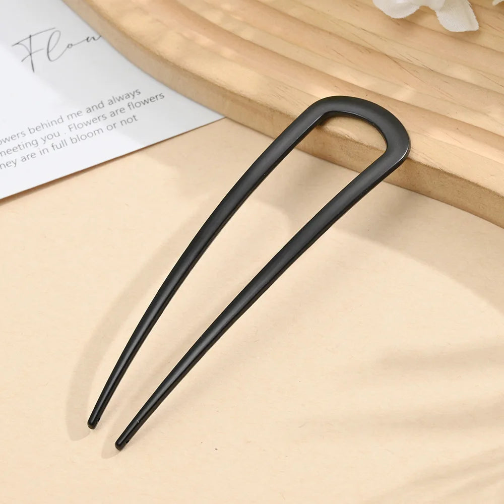 Colette Minimal slim metal hair pin in a bun
