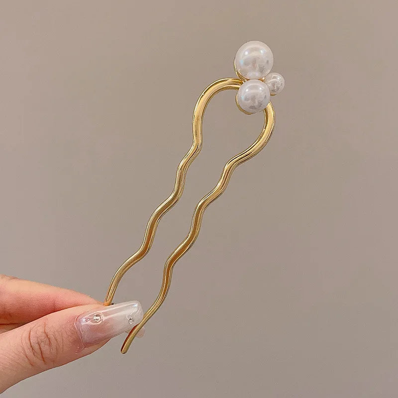 Colette Atelier pearl hair stick in a bun