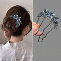 Colette Jardin blue crystal flower hair pin in an updo