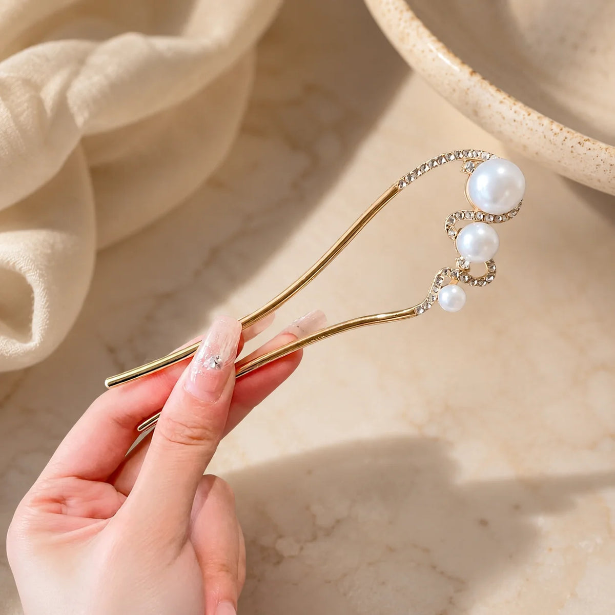 Colette Perle pearl-topped French hair pin in a chignon