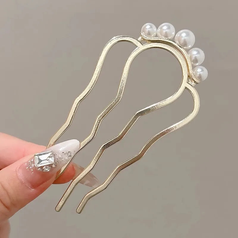 Colette Atelier pearl hair stick in a bun