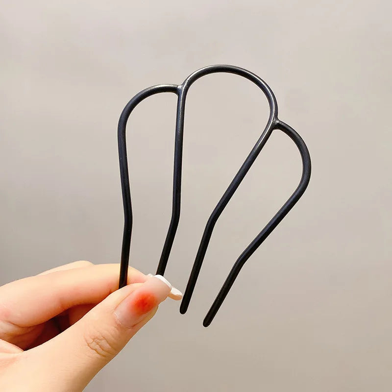 Colette Atelier pearl hair stick in a bun