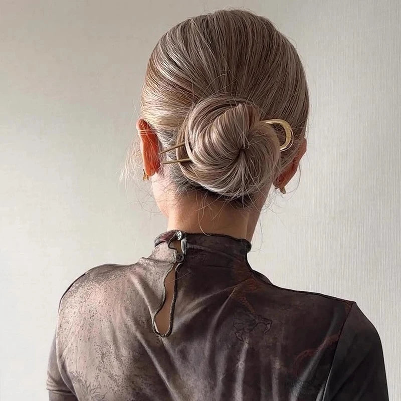 Colette Minimal slim metal hair pin in a bun