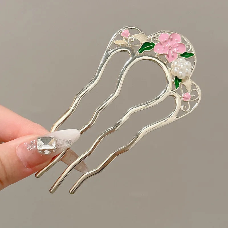 Colette Atelier pearl hair stick in a bun