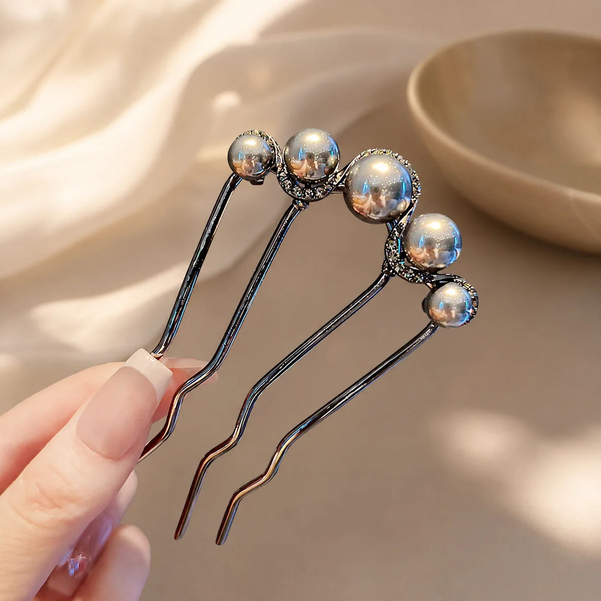Colette Perle pearl-topped French hair pin in a chignon