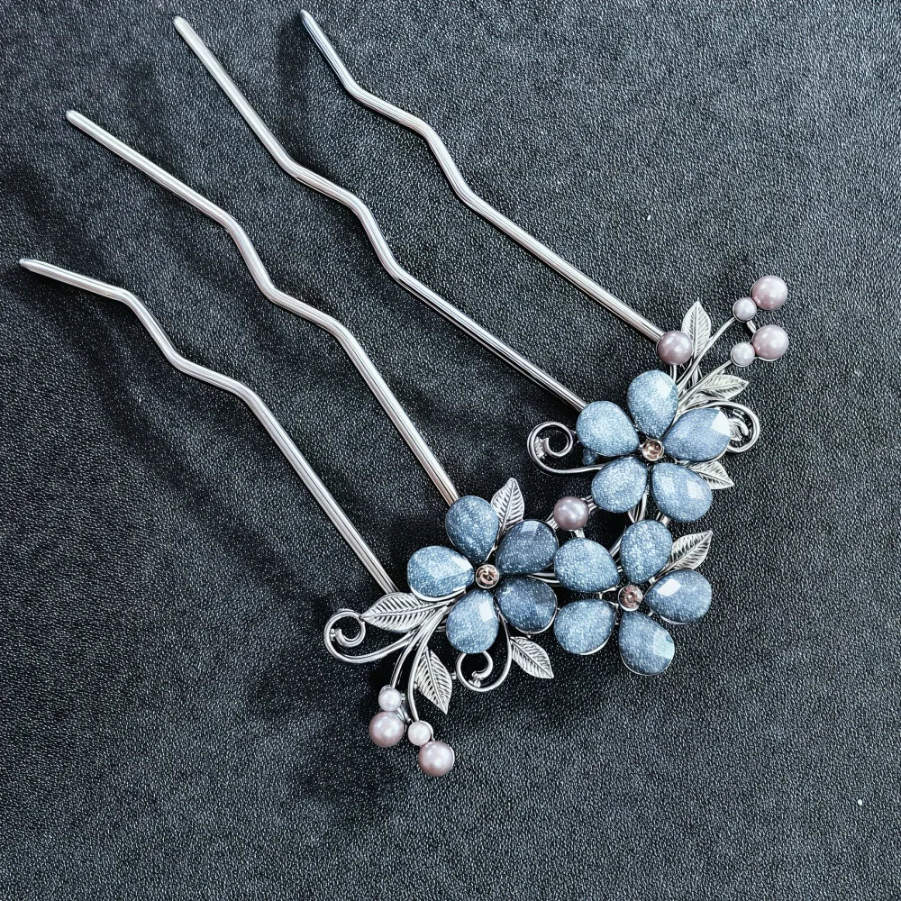 Colette Jardin blue crystal flower hair pin in an updo