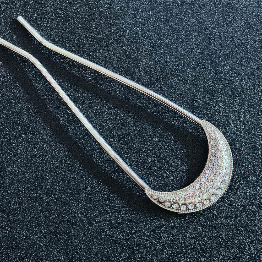 Colette Jardin blue crystal flower hair pin in an updo